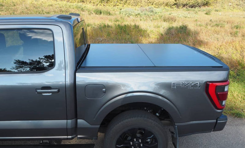 Load image into Gallery viewer, Ford F-150 Phoenix Black Blackbird Automatic Hard Folding Tonneau Cover for 2015 to 2025
